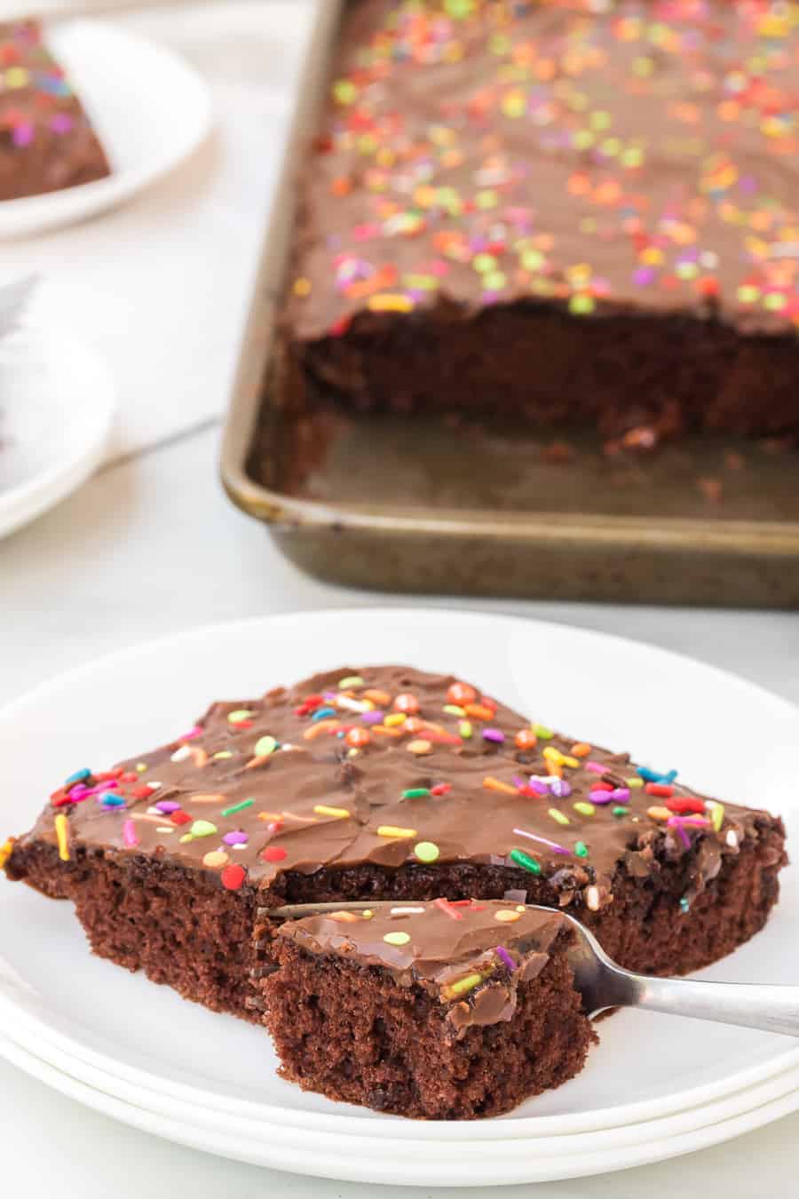 chocolate sheet cake with sprinkles on top.