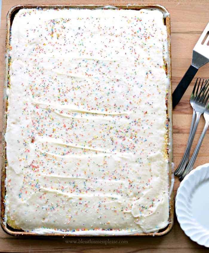 Quick and Easy Vanilla Sheet Cake Recipe - cheat a little with a box mix plus easy homemade icing and sprinkles for the win!