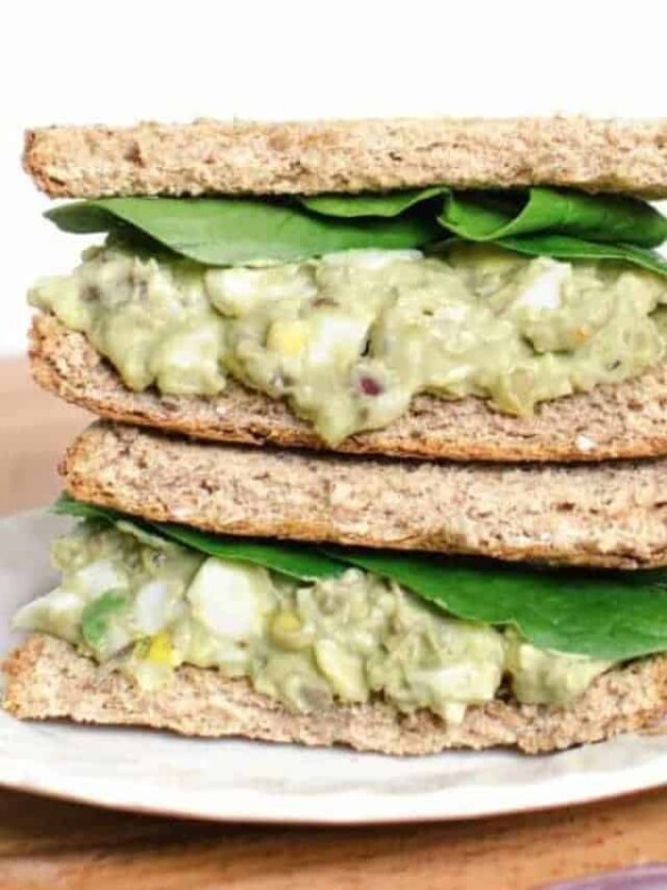 Avocado Egg Salad sandwiches stacked on a plate