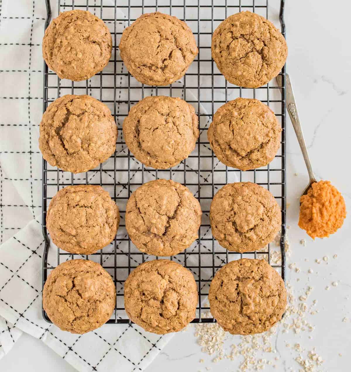 pumpkin spice muffins on a cooling rack.