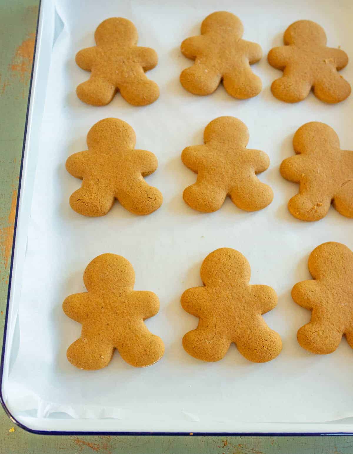 rows of gluten free gingerbread men on a baking tray