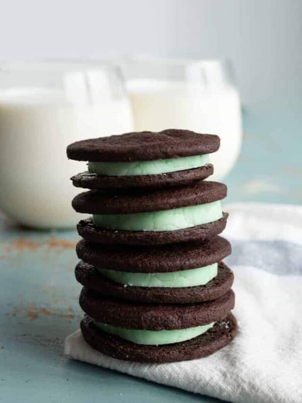 Homemade Mint Oreo cookies made with dark cocoa powder are crispy on the outside, with a perfect mint cream filling in the middle.