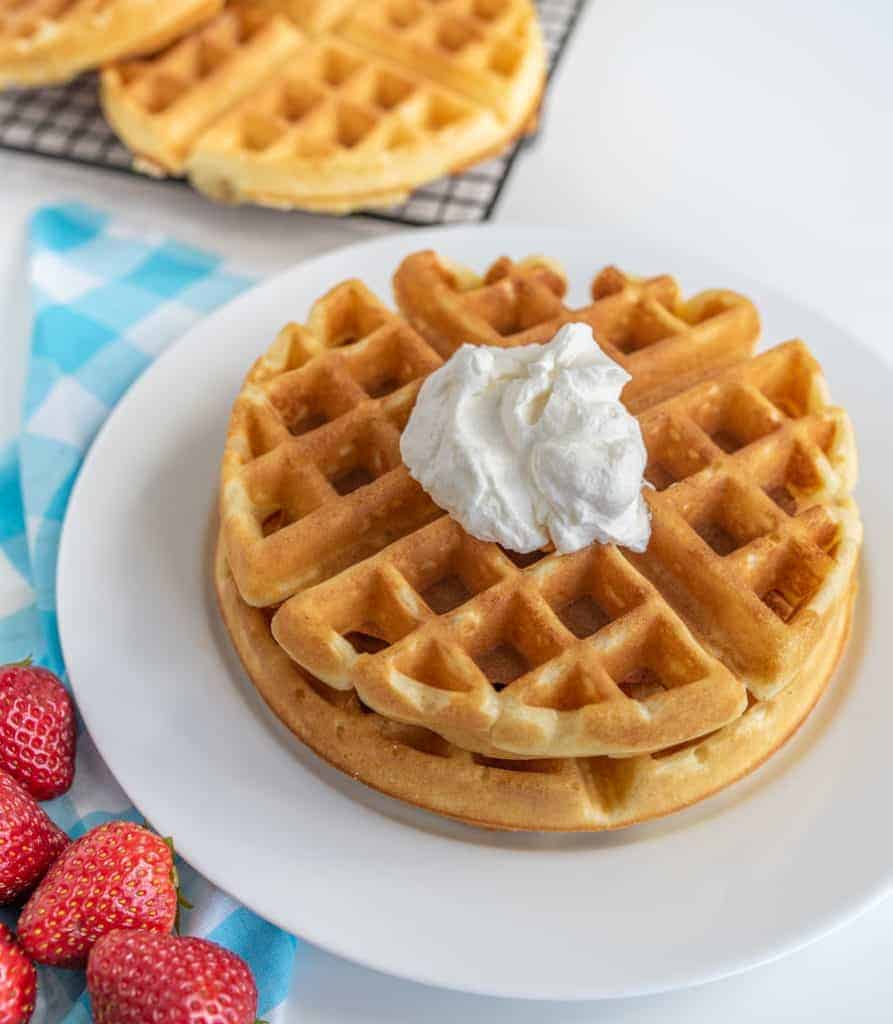 classic waffles, perfectly golden and fluffy with whipped cream.