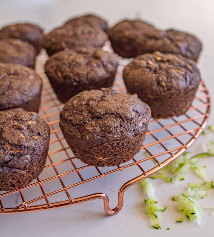 chocolate zucchini muffins on a cooling rack.