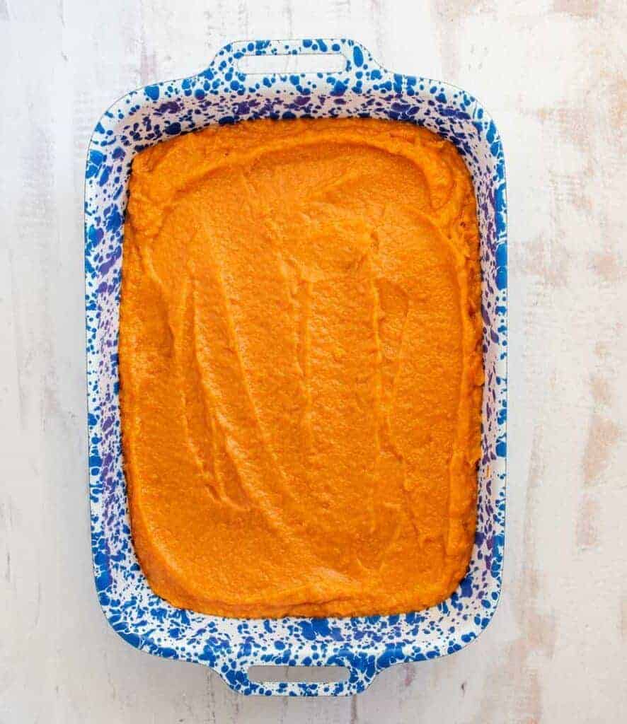 sweet potato casserole in a white and blue pan