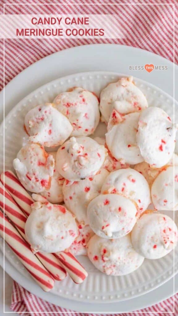 text reads "candy cane meringue cookies" meringue balls with broken candy cane pieces on them, on a white plate