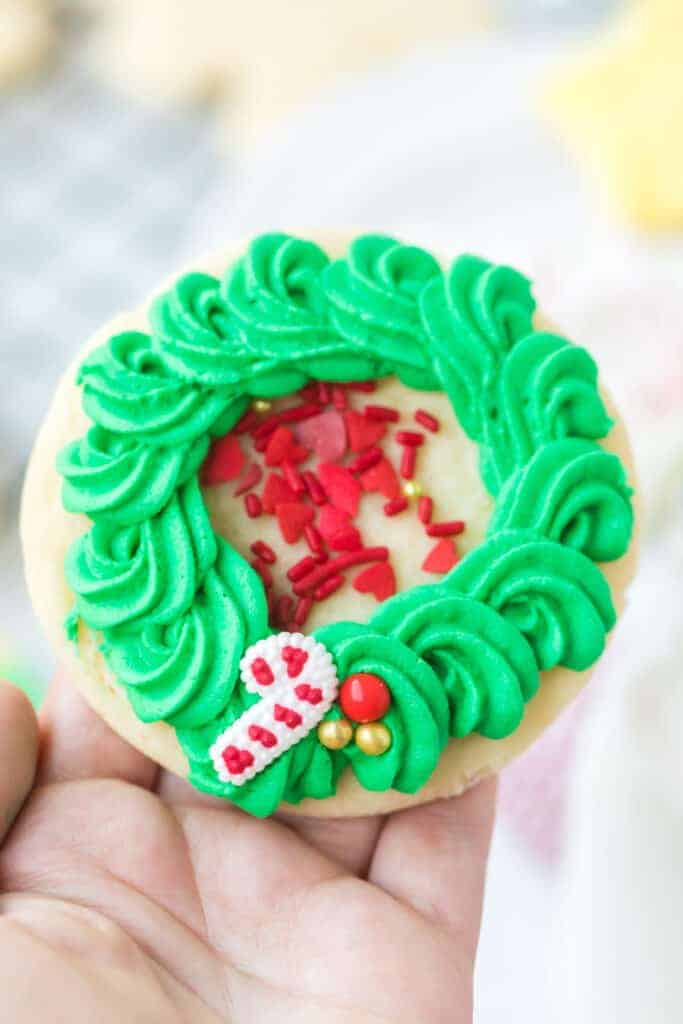 iced sugar cookie decorated like a wreath