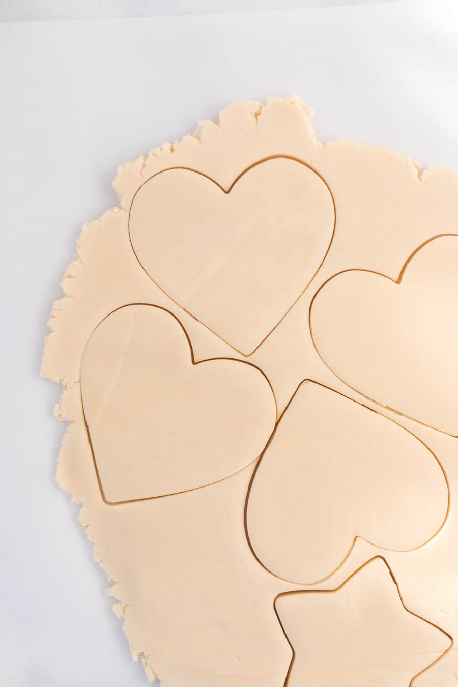 hearts cut out of shortbread cookie dough.