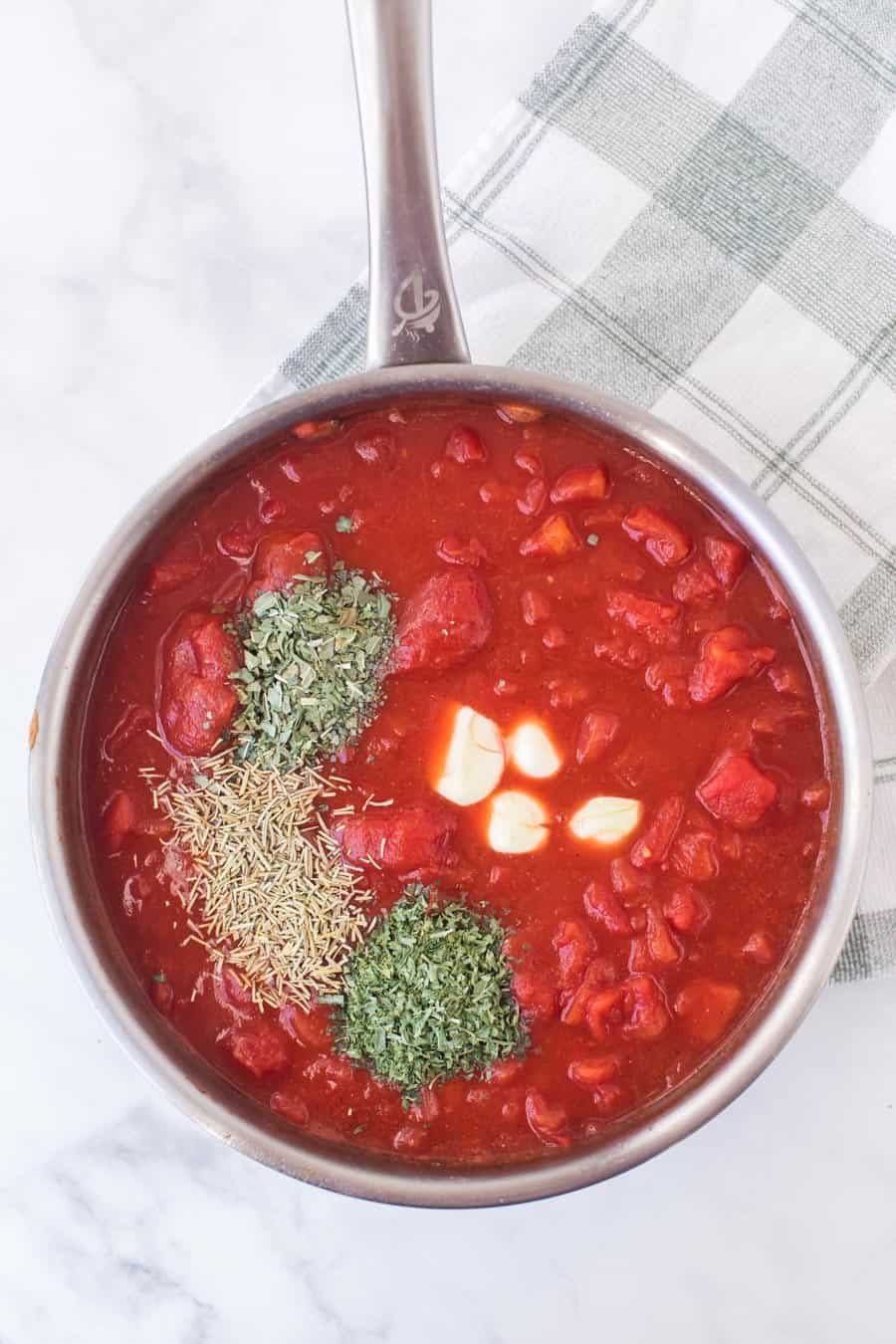 tomato sauce boiling in a pan.