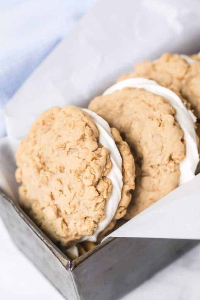 a bread pan stacked with oatmeal cream pies