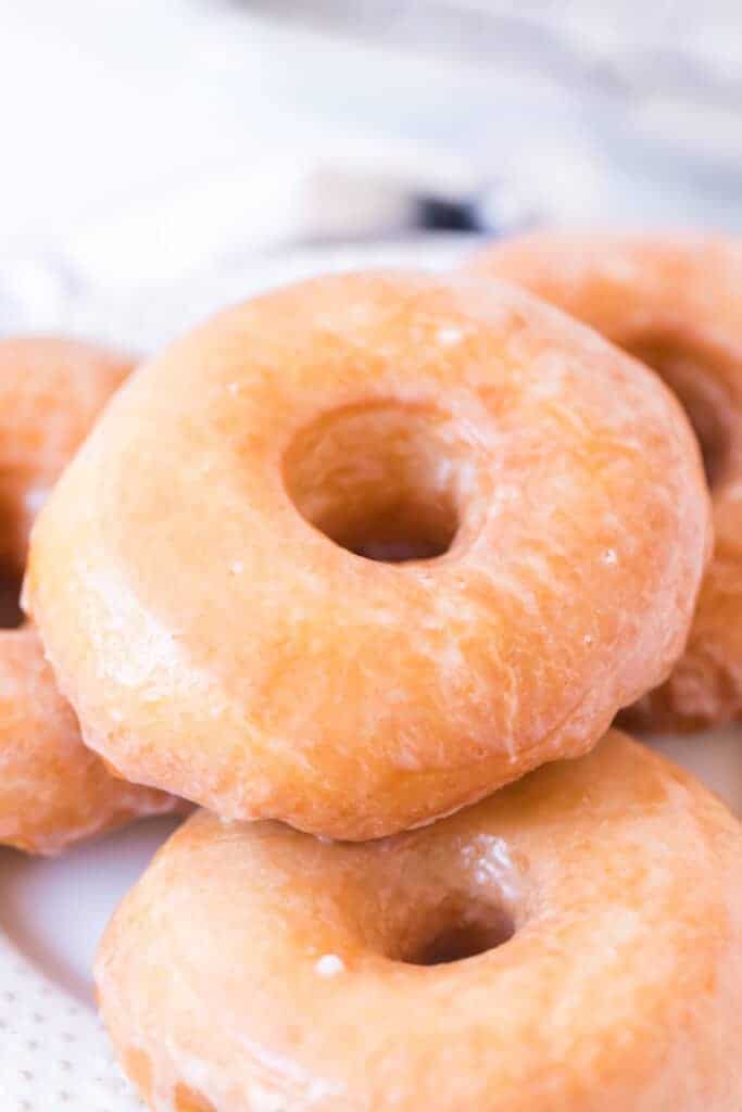 top view of a pile of old fashioned glazed doughnuts