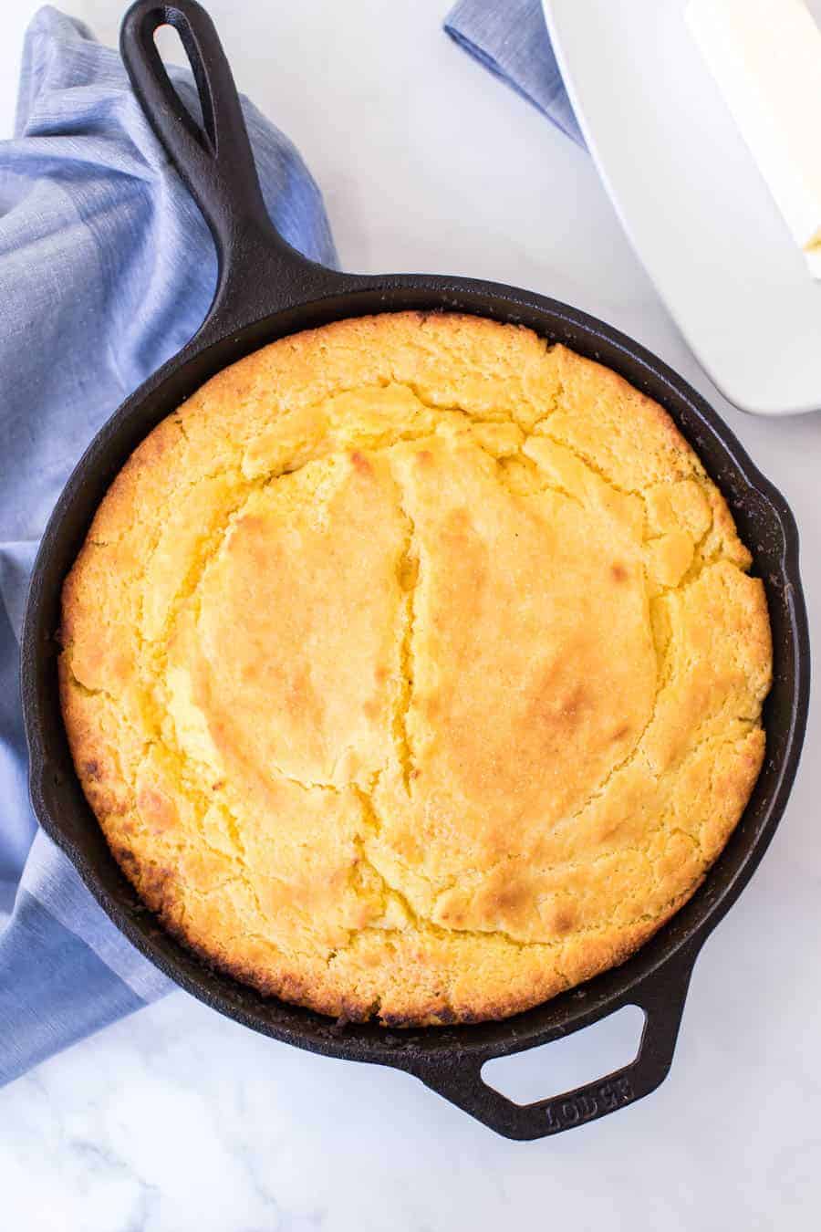 top view of cornbread baked in a cast iron skillet.