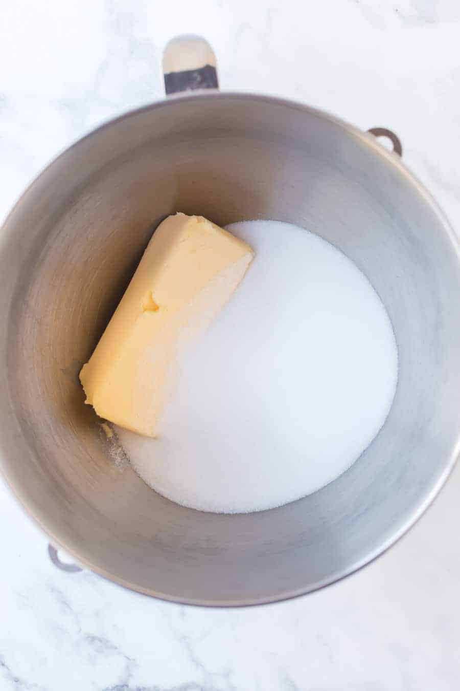 sugar cookie ingredients in a metal mixing bowl.