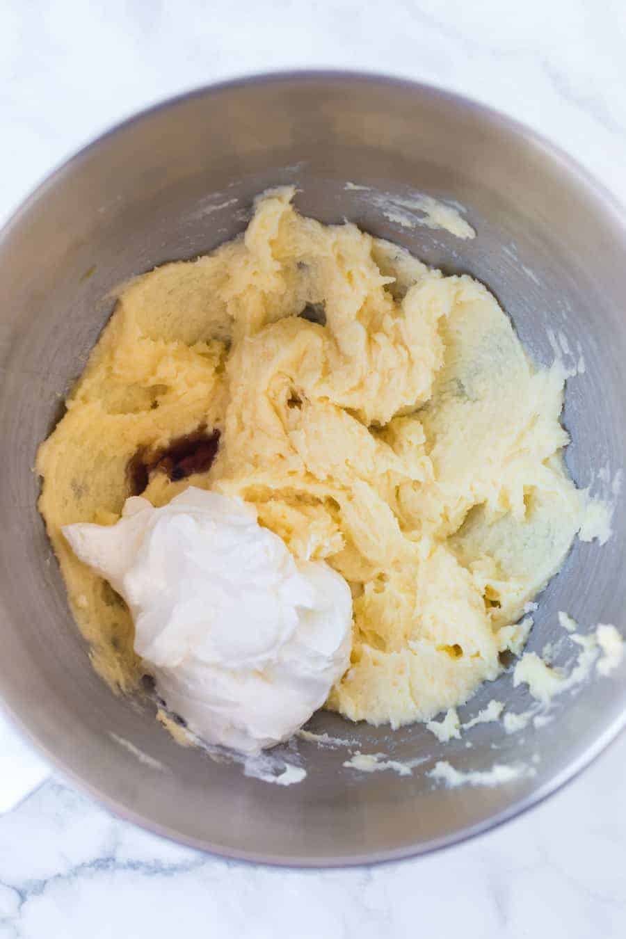 sugar cookie ingredients in a metal mixing bowl.