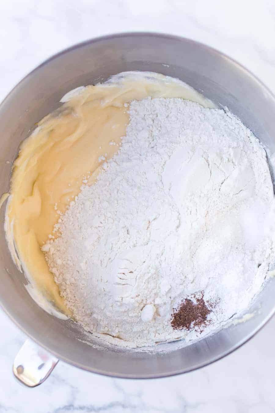 sugar cookie ingredients in a metal mixing bowl.