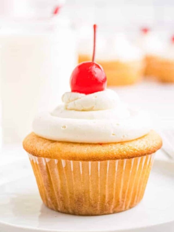 cherry chip cupcake with icing and maraschino cherry on top