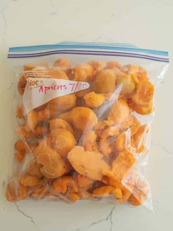 a freezer bag of cut apricots