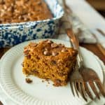 pumpkin cake on white plate with fork