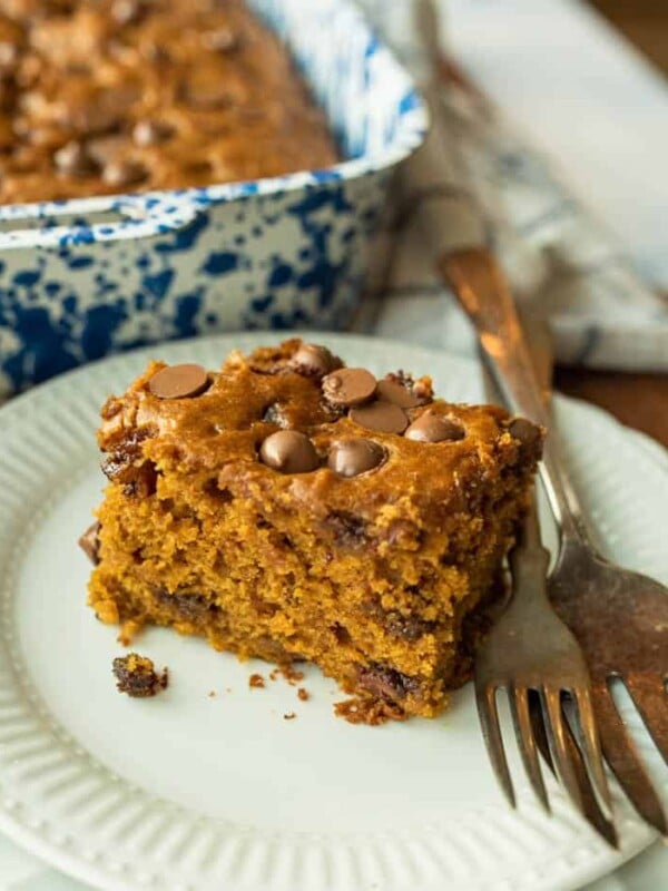 pumpkin cake on white plate with fork