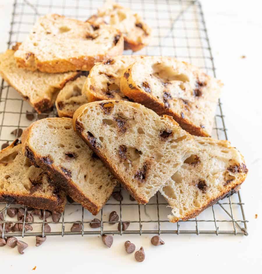 sourdough chocolate chip bread slices on a cooling rack
