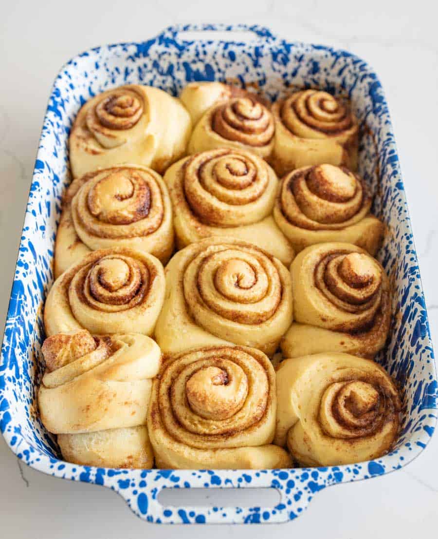 baking dish of baked sourdough cinnamon rolls not iced.