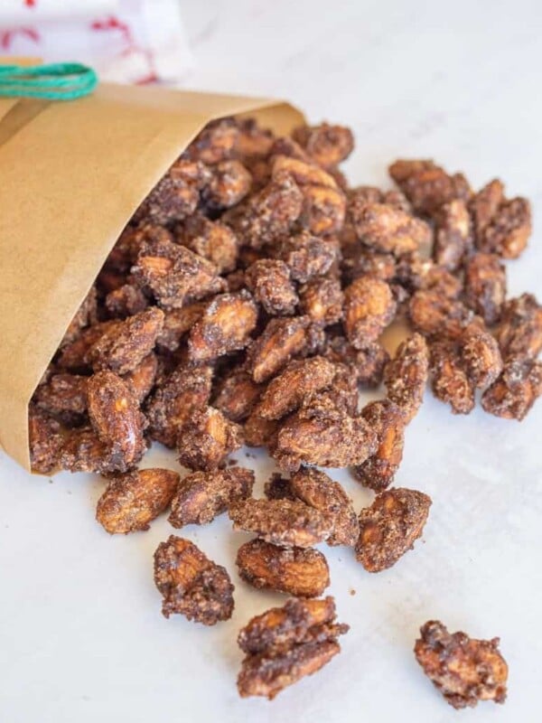 candied almonds spilling out of brown bag