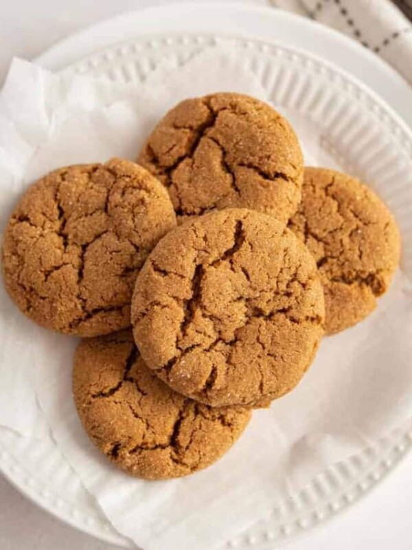 top view of molasses cookies stacked on a plate