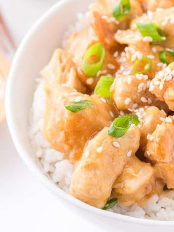 close up of a bowl of honey sesame chicken