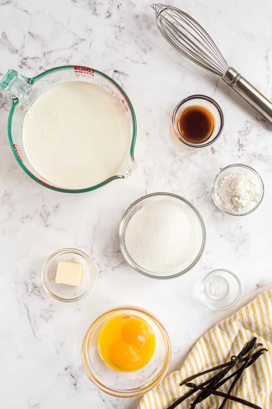 Top view of ingredients for pudding in bowls. 