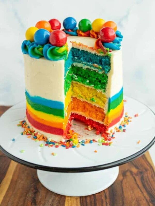 rainbow cake on a cake stand