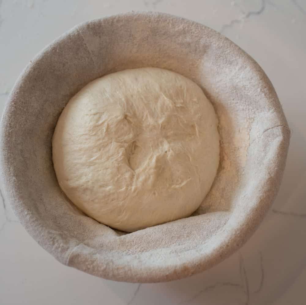 sourdough bread dough in a prepared basket.