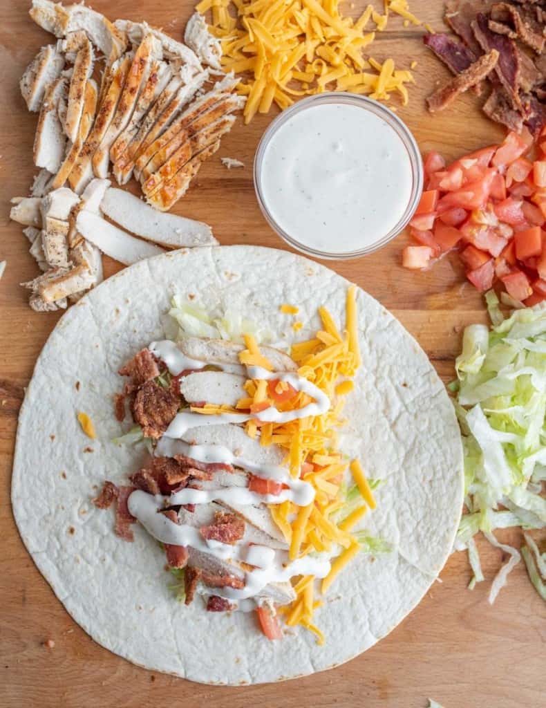 https://www.blessthismessplease.com/wp-content/uploads/2022/04/chicken-wrap-with-bacon-and-ranch-3-790x1024.jpg