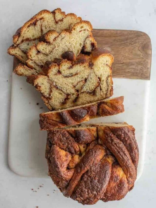 top view of a sliced loaf of cinnamon bread sliced half way