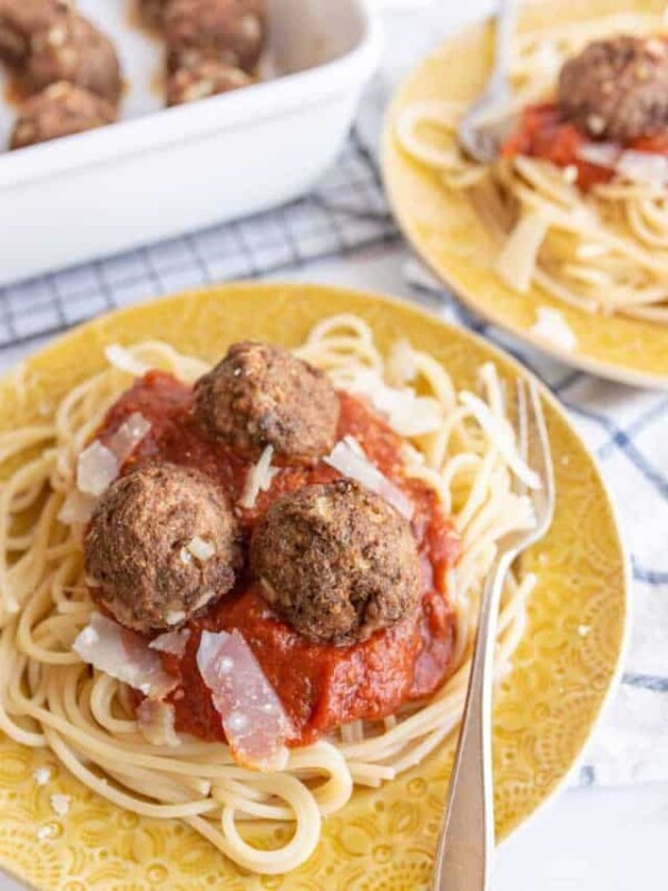 yellow plate of spaghetti with turkey meatballs on top