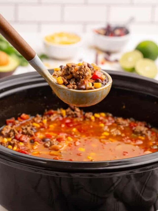 slow cooker and a ladle with taco soup