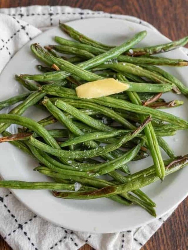 plated air fryer green beans with butter and salt.