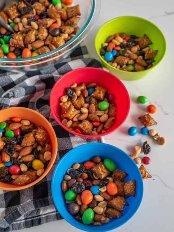 multi colored bowls filled with trail mix