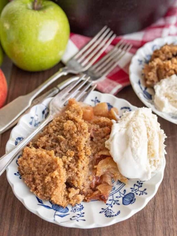 apple crumble served on a plate with ice cream