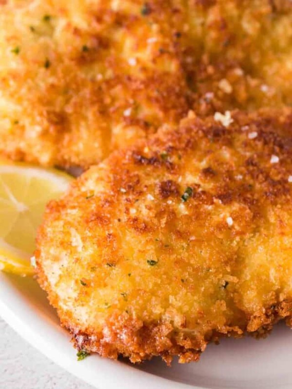 close up chicken kiev breaded with sea salt and lemon