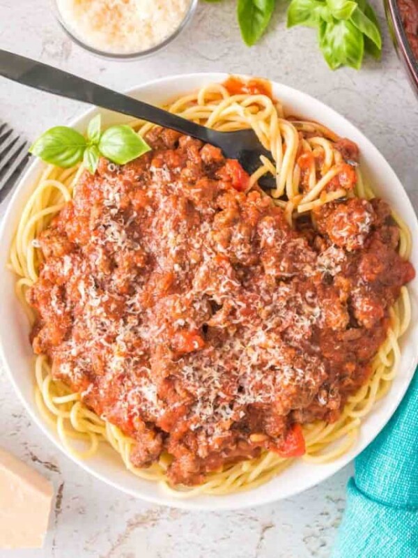 top view of easy homemade spaghetti sauce on pasta on a white plate