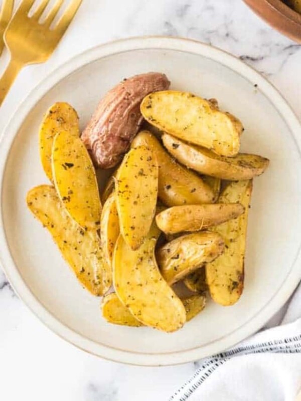 Roasted fingerling potatoes on a plate and ready to devour