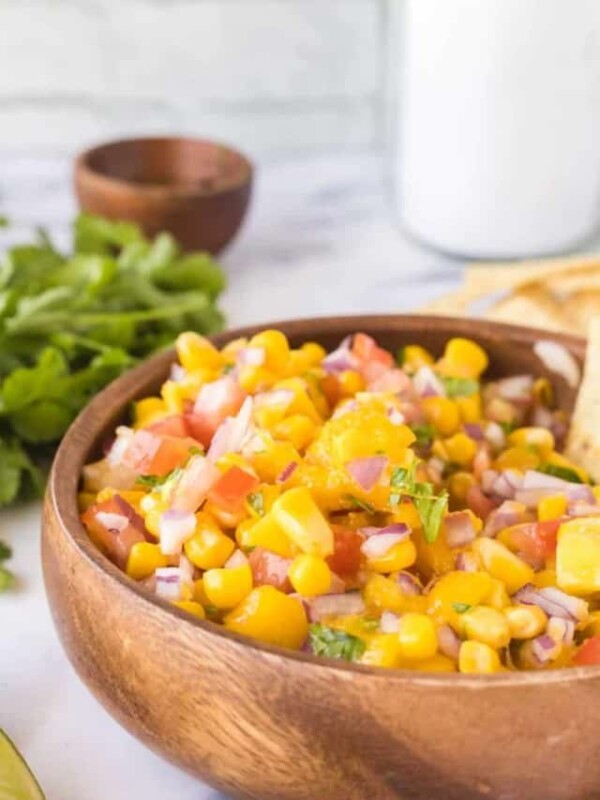 mango salsa in a wooden mixing bowl