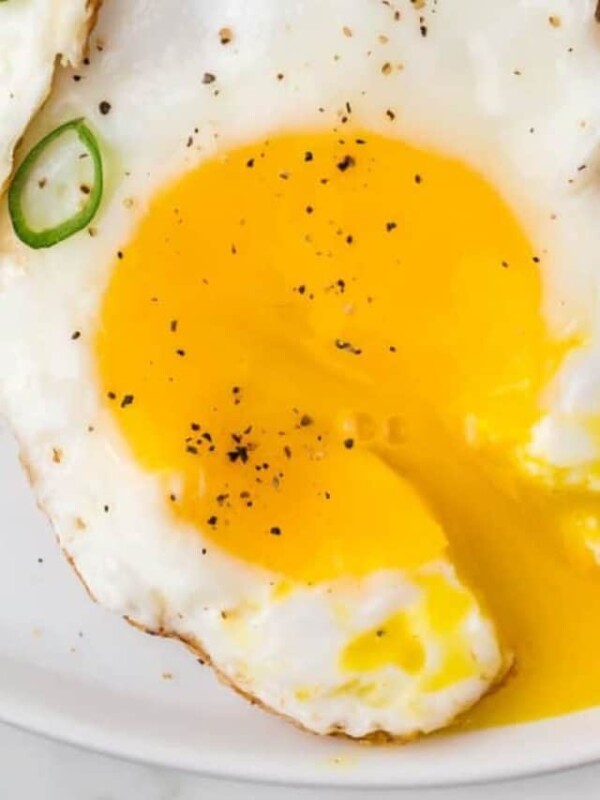 sunny side up egg on a plate with a gooey yolk