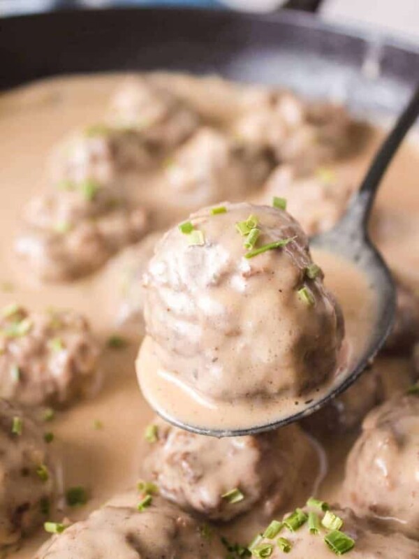 swedish meatball POV on a spoon with sauce