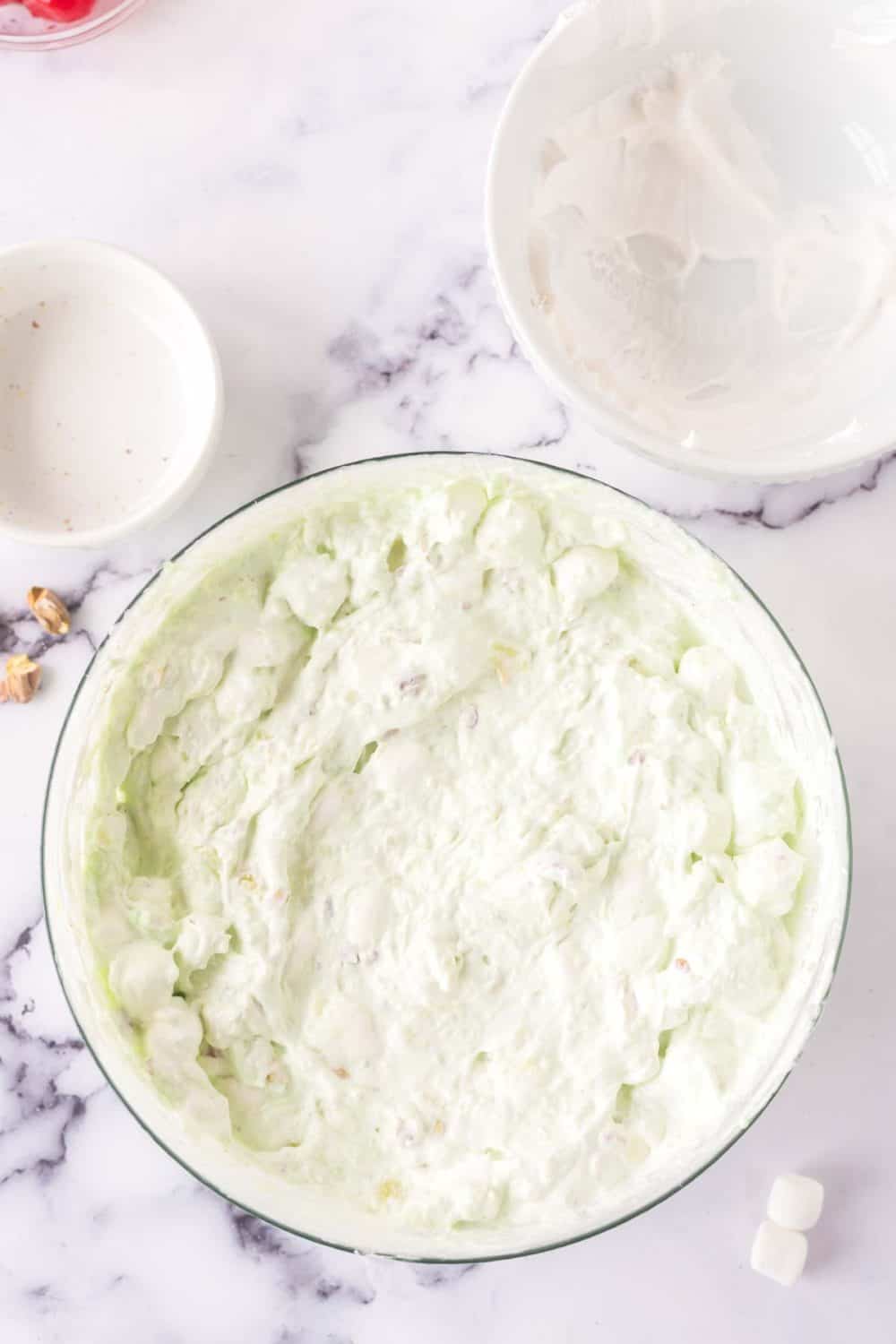 pistachio jello salad ingredients coming together.