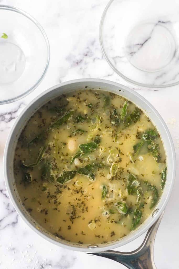 white bean soup recipe in a sauce pan.