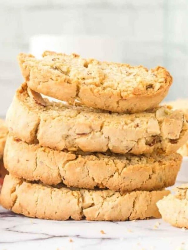 almond biscotti recipe with chocolate dip on the side stacked on a plate