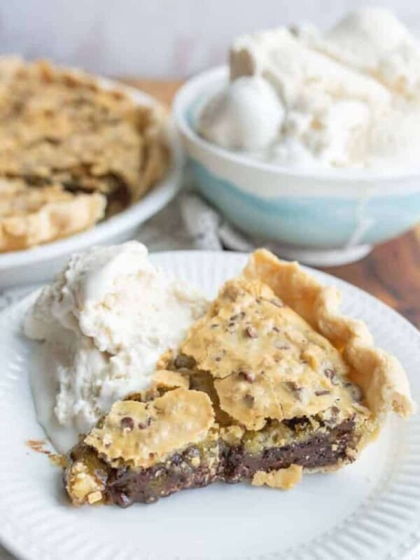 one wedge serving of derby pie with ice cream on a plate