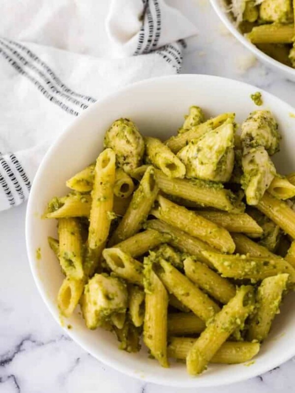 white bowl of chicken pesto pasta