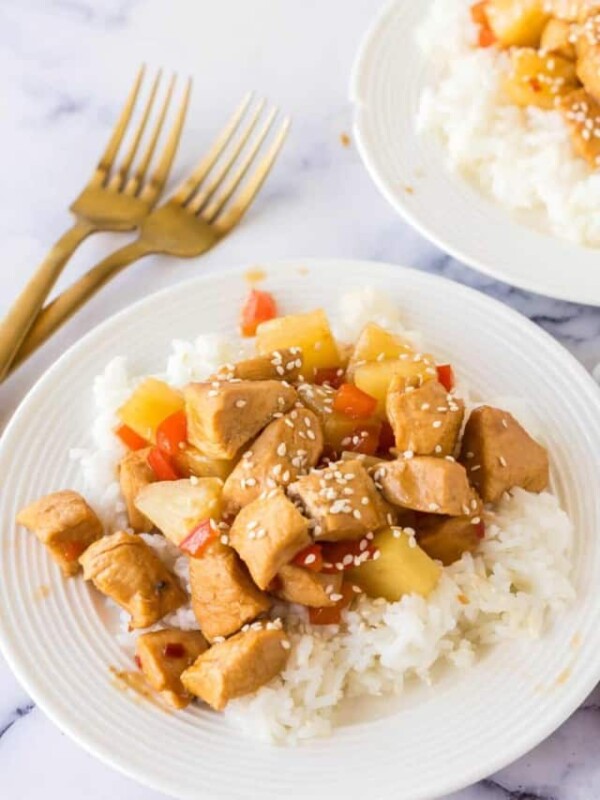 hawaiian chicken with rice served on a white plate